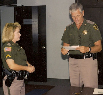 Daisy Vallely receives commendation from Tulsa Police Chief Ron Palmer.